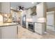 Spacious kitchen with stainless steel appliances, granite countertops, and white cabinets at 2526 Rio Plato Dr, Punta Gorda, FL 33950