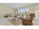 Cozy living room with neutral tones, comfortable furniture, and lots of natural light at 2526 Rio Plato Dr, Punta Gorda, FL 33950