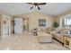 Spacious living room featuring tile floors, ceiling fan, and comfortable sectional sofa at 2526 Rio Plato Dr, Punta Gorda, FL 33950