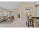 Bright, open-concept living room with neutral tones, adjacent to a kitchen and dining area, perfect for entertaining at 2526 Rio Plato Dr, Punta Gorda, FL 33950