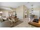 Inviting living room with travertine tile flooring, neutral paint, and a seamless transition to other living spaces at 2526 Rio Plato Dr, Punta Gorda, FL 33950