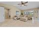 Open-concept living room with large window and sleek tile flooring at 2526 Rio Plato Dr, Punta Gorda, FL 33950