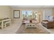 Bright living room with tile floors, neutral walls, and large window with natural light at 2526 Rio Plato Dr, Punta Gorda, FL 33950