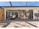 Entertain on the patio with a covered outdoor kitchen, bar seating, and lounge area at 2526 Rio Plato Dr, Punta Gorda, FL 33950