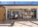 Covered patio with an outdoor kitchen, bar seating, dining area, and access to the pool and waterfront at 2526 Rio Plato Dr, Punta Gorda, FL 33950