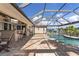 Enjoy waterfront views from the pool with bar seating under a screened enclosure at 2526 Rio Plato Dr, Punta Gorda, FL 33950