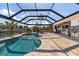 Relax in this refreshing screened-in pool area overlooking a canal at 2526 Rio Plato Dr, Punta Gorda, FL 33950