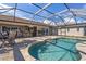 Relaxing screened-in pool area with covered outdoor bar and entertainment space at 2526 Rio Plato Dr, Punta Gorda, FL 33950