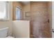 Bathroom shower with neutral tile, mosaic accents, and a frameless glass door at 2526 Rio Plato Dr, Punta Gorda, FL 33950