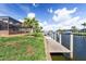 Waterfront property features a concrete dock, canal access, and serene views on a sunny day at 2526 Rio Plato Dr, Punta Gorda, FL 33950