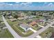 Overhead view of home, showcasing its well-maintained landscaping, outdoor screened-in pool, and neighborhood at 25308 Rupert Rd, Punta Gorda, FL 33983