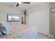 Relax in this bedroom with neutral colors and a large closet at 25308 Rupert Rd, Punta Gorda, FL 33983