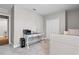 This bedroom boasts a desk, built in storage and a view to the hallway at 25308 Rupert Rd, Punta Gorda, FL 33983