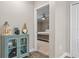 Hallway view looking into bedroom with stylish decor and neutral color palette at 25308 Rupert Rd, Punta Gorda, FL 33983