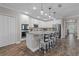 Bright kitchen with white cabinets, granite countertops, and seating at the island at 25308 Rupert Rd, Punta Gorda, FL 33983
