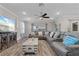 Cozy living room featuring a large sectional sofa and modern decor accents at 25308 Rupert Rd, Punta Gorda, FL 33983