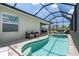 Screened in lanai featuring a pool and hot tub for relaxation and enjoyment at 25308 Rupert Rd, Punta Gorda, FL 33983