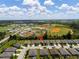 Aerial view of the community showing its location near baseball fields and surrounding amenities at 25312 E Lenox Cir, Punta Gorda, FL 33950