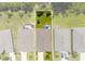 Aerial view of the property showing its rectangular lot, backyard patio, and proximity to other homes at 25312 E Lenox Cir, Punta Gorda, FL 33950