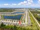 Aerial view showing the property's location within a community with lakes and well-maintained surroundings at 25312 E Lenox Cir, Punta Gorda, FL 33950