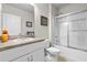 Practical bathroom featuring a shower-tub combo with sliding doors and a single-sink vanity at 25312 E Lenox Cir, Punta Gorda, FL 33950