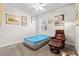 Bedroom featuring an inflatable mattress, a leather armchair, carpet and a window for natural light at 25312 E Lenox Cir, Punta Gorda, FL 33950