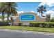 Waterford community entrance sign surrounded by lush landscaping and palm trees on a sunny day at 25312 E Lenox Cir, Punta Gorda, FL 33950