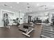 Well-equipped gym featuring various machines, weights, mirrors, rubber flooring, and ample lighting at 25312 E Lenox Cir, Punta Gorda, FL 33950