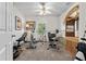 Home gym features carpet, a ceiling fan, weight-lifting equipment and a mirrored shelf at 25312 E Lenox Cir, Punta Gorda, FL 33950
