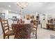 Open-concept kitchen flows into the dining and living areas, perfect for modern living and entertaining at 25312 E Lenox Cir, Punta Gorda, FL 33950