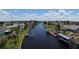 Waterfront homes sit along a scenic canal with private docks, offering boat access and beautiful views at 27193 And 27197 Voyageur Dr, Punta Gorda, FL 33983
