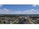 Scenic community aerial view showcases waterfront homes on a canal, offering boating opportunities at 27193 And 27197 Voyageur Dr, Punta Gorda, FL 33983