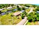 Aerial view of a neighborhood featuring canal access, spacious yards, and lush greenery at 27193 And 27197 Voyageur Dr, Punta Gorda, FL 33983