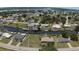 Aerial view of a waterfront property on a canal surrounded by lush landscaping and neighboring homes at 27193 And 27197 Voyageur Dr, Punta Gorda, FL 33983