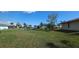 Expansive backyard showcasing the waterfront views and providing ample space for outdoor activities at 27193 And 27197 Voyageur Dr, Punta Gorda, FL 33983