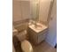 Efficient bathroom layout with a wall cabinet and neutral finishes at 27193 And 27197 Voyageur Dr, Punta Gorda, FL 33983