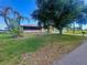 Charming home with well-manicured lawn and mature trees in a tranquil neighborhood at 27193 And 27197 Voyageur Dr, Punta Gorda, FL 33983