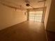 Spacious garage with a roll-up door, providing ample storage and parking at 27193 And 27197 Voyageur Dr, Punta Gorda, FL 33983