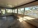 Enclosed lanai featuring waterfront views, ideal for relaxing and enjoying the outdoors at 27193 And 27197 Voyageur Dr, Punta Gorda, FL 33983