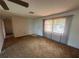 Living room with carpet and a large window offering plenty of natural light at 27193 And 27197 Voyageur Dr, Punta Gorda, FL 33983