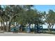 Neighborhood playground offers a fun, safe space for , nestled among mature shade trees at 27193 And 27197 Voyageur Dr, Punta Gorda, FL 33983
