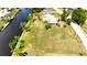 Canal-front home with an expansive lot, offering direct water access and ample space at 27193 And 27197 Voyageur Dr, Punta Gorda, FL 33983
