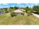 Spacious lot with lush lawn backing onto the canal, situated in a peaceful residential area at 27193 And 27197 Voyageur Dr, Punta Gorda, FL 33983