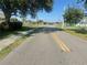 Neighborhood street offers a quiet setting, showcasing the area's charm and curb appeal at 27193 And 27197 Voyageur Dr, Punta Gorda, FL 33983
