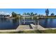 Scenic waterfront view showcasing boat lifts with serene water reflecting the clear blue sky at 27193 And 27197 Voyageur Dr, Punta Gorda, FL 33983