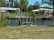 Scenic view of waterfront properties with boat docks along a tranquil canal at 27193 And 27197 Voyageur Dr, Punta Gorda, FL 33983