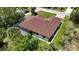 Overhead view of the home's roof, screened in patio, and spacious green lawn at 2955 Carmela Ave, North Port, FL 34286