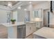 Spacious kitchen with a large island, stainless steel appliances, and modern pendant lights at 2955 Carmela Ave, North Port, FL 34286