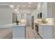 Kitchen with a spacious island, stainless steel appliances, and modern fixtures at 2955 Carmela Ave, North Port, FL 34286