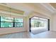 Open-concept living area featuring wood-look flooring and sliding glass doors at 2955 Carmela Ave, North Port, FL 34286